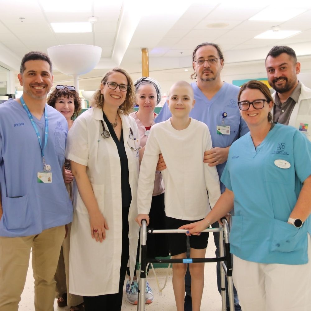 Mark, 15, stands with members of the multidisciplinary team from Clalit Schneider Children’s Medical Center